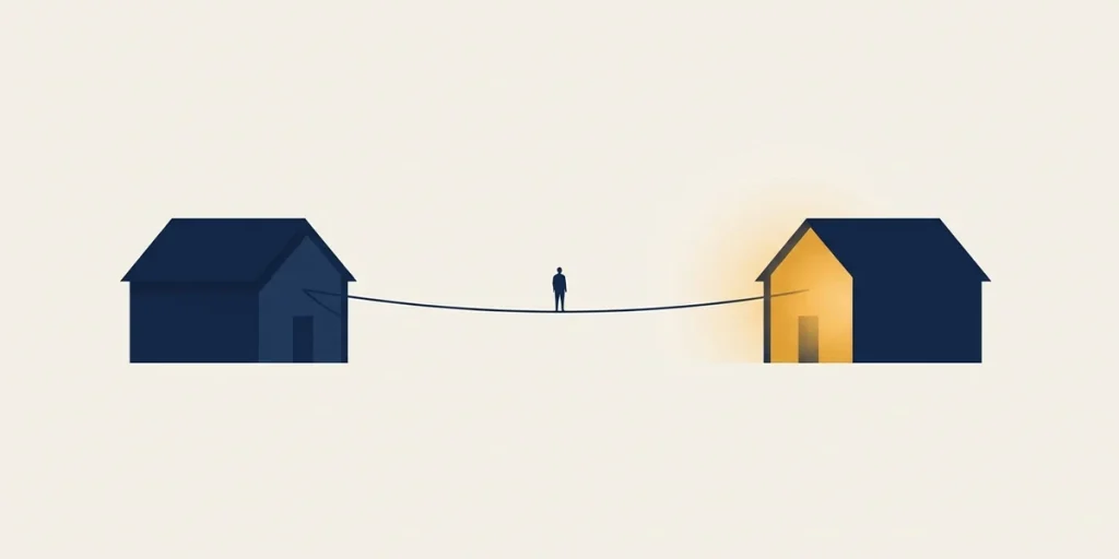 Persona en equilibrio sobre una cuerda entre dos casas, ilustrando la transición financiera con una hipoteca puente