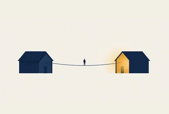Persona en una cuerda que conecta dos viviendas, ilustrando cómo funciona la hipoteca puente